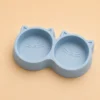 Blue cat-face shaped Double Cat Food Bowl, empty top view