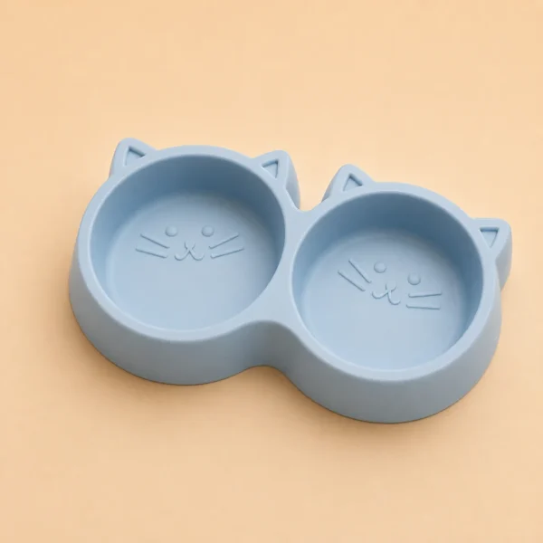 Blue cat-face shaped Double Cat Food Bowl, empty top view