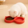 White cat eating from red Double Cat Food Bowl