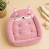 Empty pink fox-shaped cat bed showing tufted cushion and raised rim