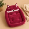 Maroon fox-shaped cat bed with tufted cushion and raised rim