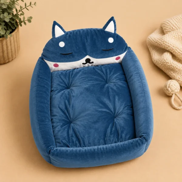 Empty blue fox-shaped cat bed showing tufted cushion and raised rim
