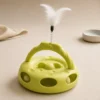 Green Interactive Rolling Ball Cat Toy with dangling feather attachment