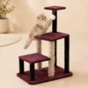 Kitten climbing Multi-Level Cat Tree Tower and reaching for hanging pom-pom ball