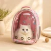 White fluffy cat sitting inside transparent bubble cat carrier backpack looking out